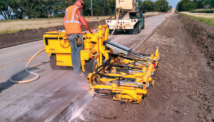 The Chester Bross crew used the E-Z Drill 210-4SRA 4-gang Slab Rider to drill 40,492 holes for the rebar that would tie the new concrete shoulder to the existing roadway E-Z Drill The Chester Bross crew