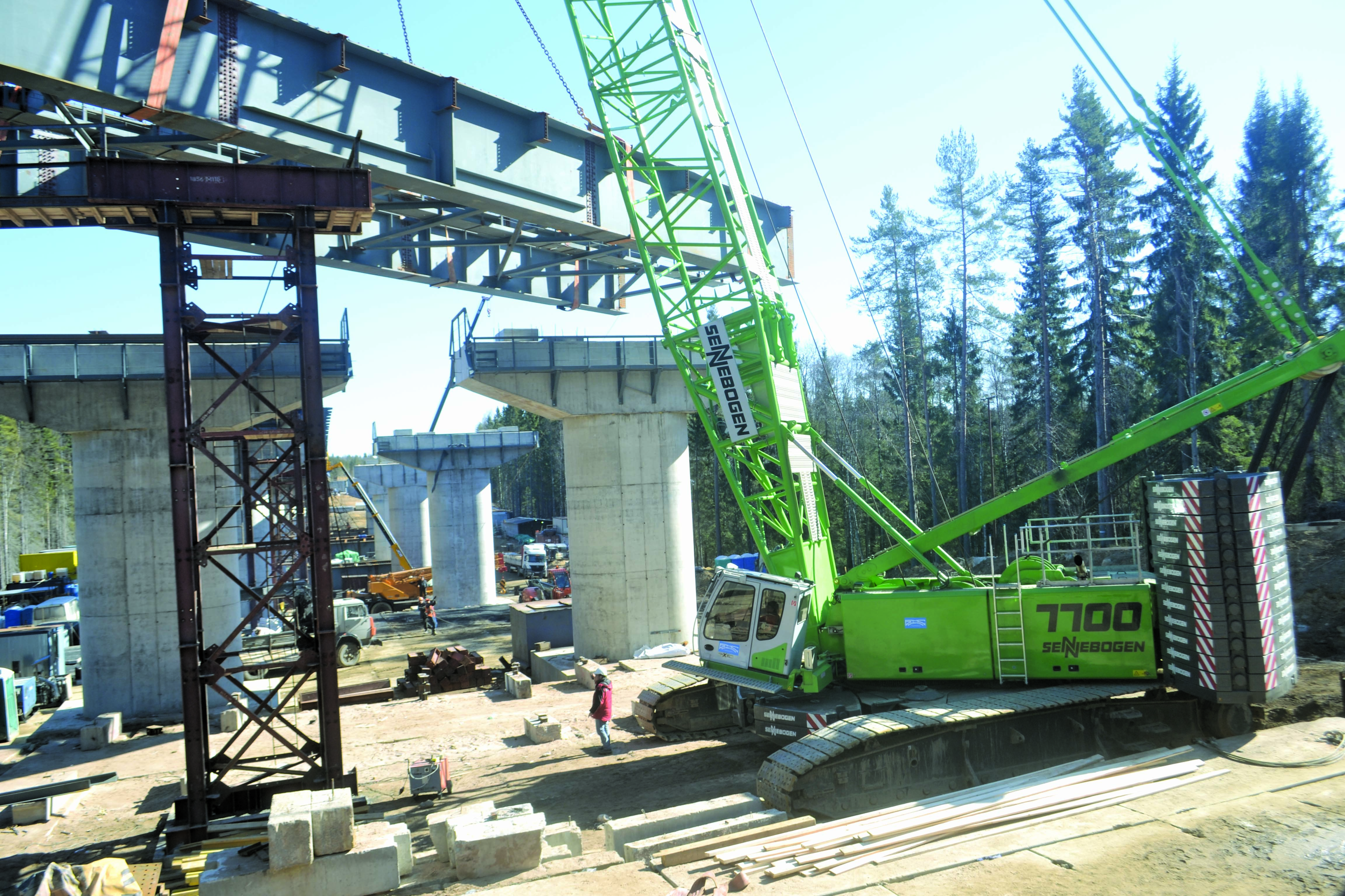 The contractor has been using the Sennebogen crane to move components weighing up to 100tonnes while constructing an 800m long freeway bridge Sennebogen crane