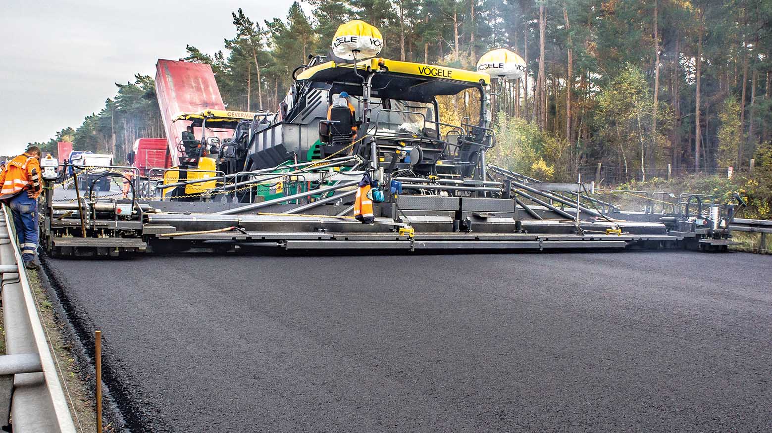 The massive Vögele paver was able to lay a mat 15.5m wide across the entire carriageway of the A10 Autobahn, without need for any joints Vögele paver on A10 Autobahn in Germany