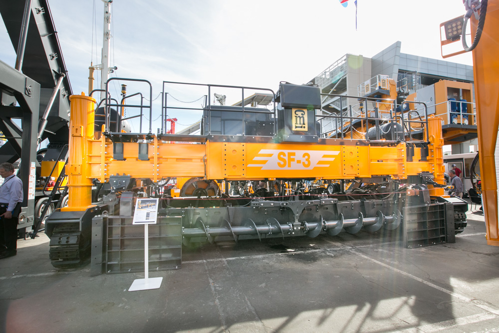 Bolt-in extensions take paving widths to 11m CMI SF-3 concrete slipform paver