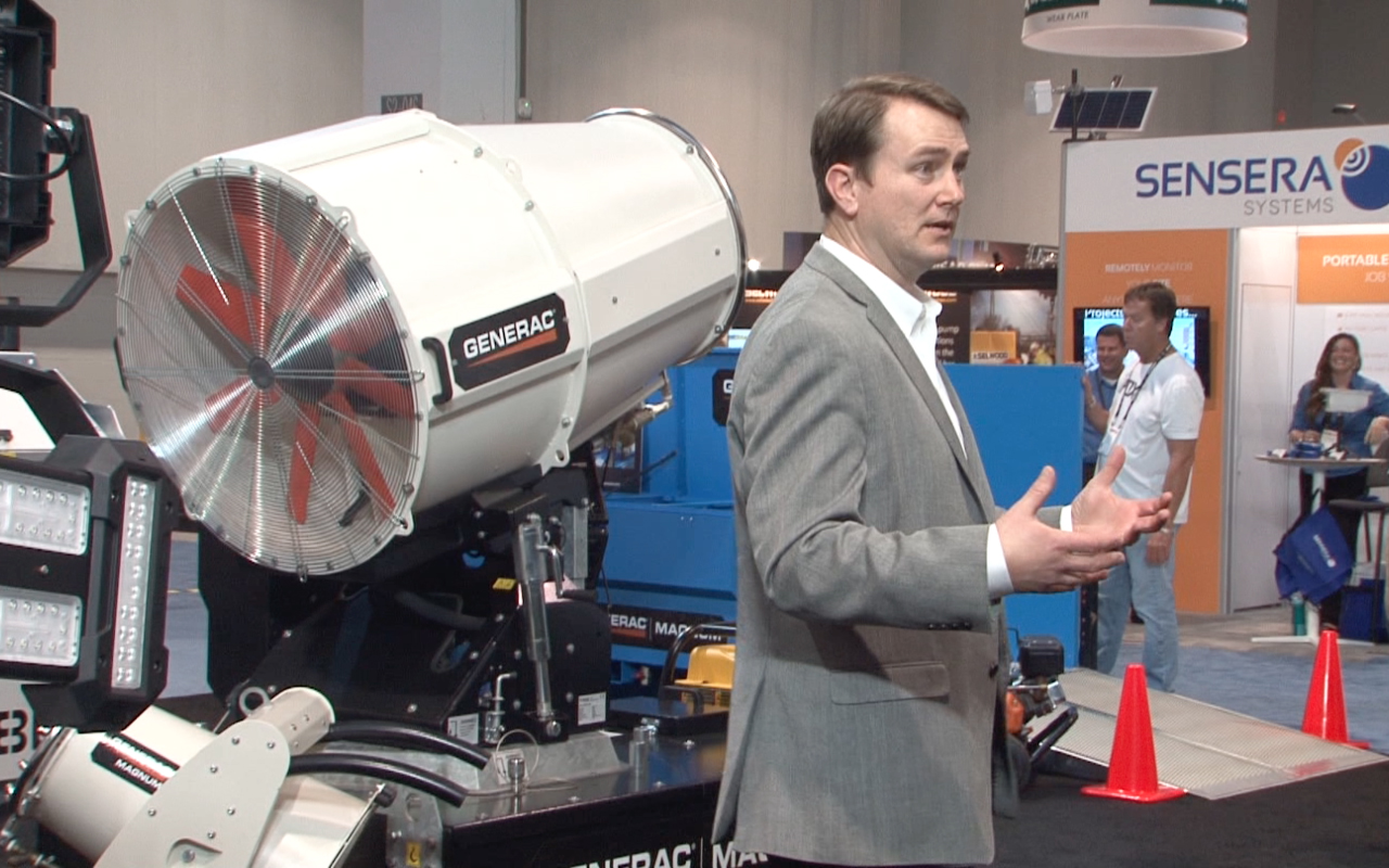 Erik Wilde of Generac with a Dust Fighter dust suppressor Generac Erik Wilde and Dust Fighter
