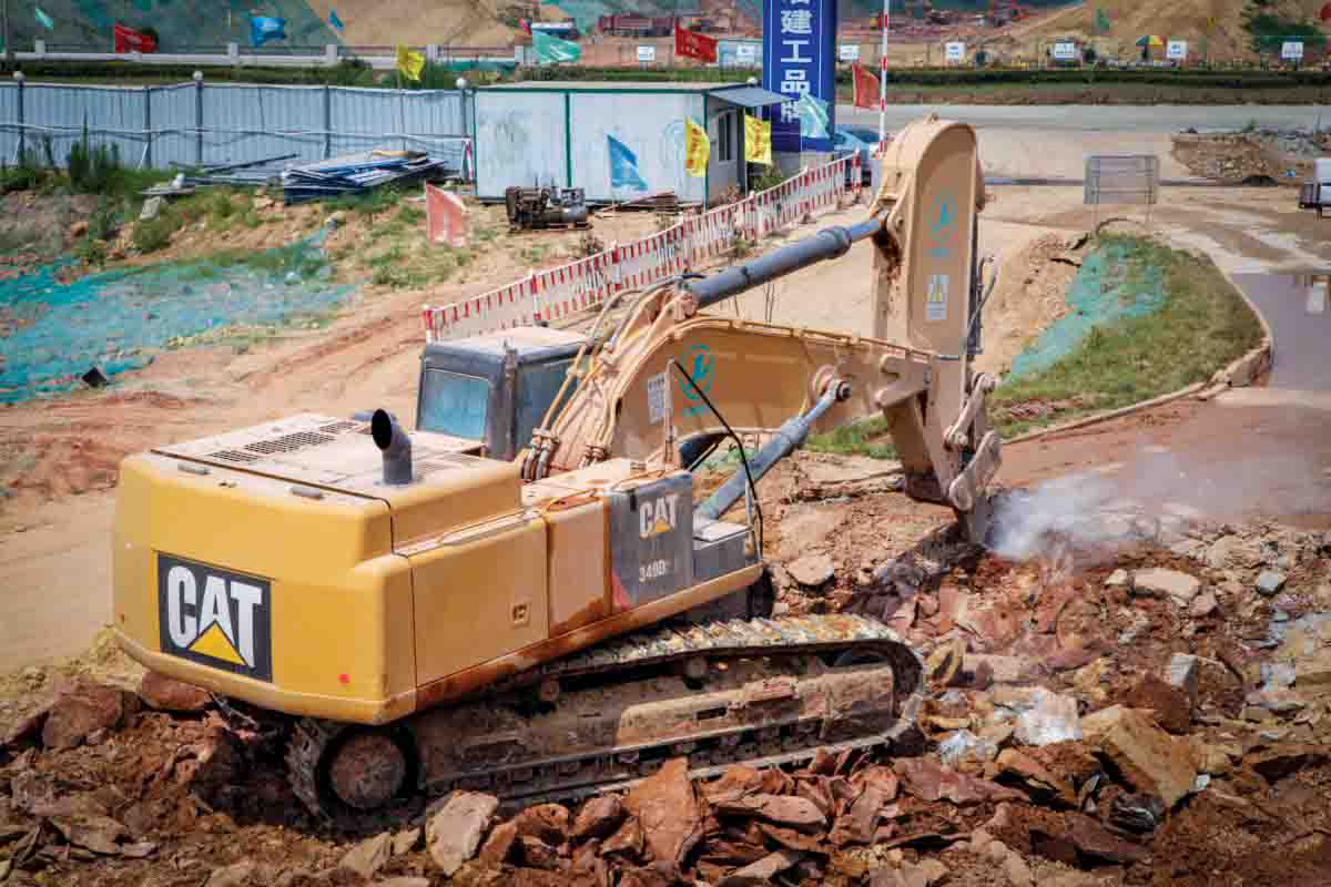 A Chinese firm is using a Caterpillar excavator in a novel configuration for road building work Caterpillar 349D L Excavator