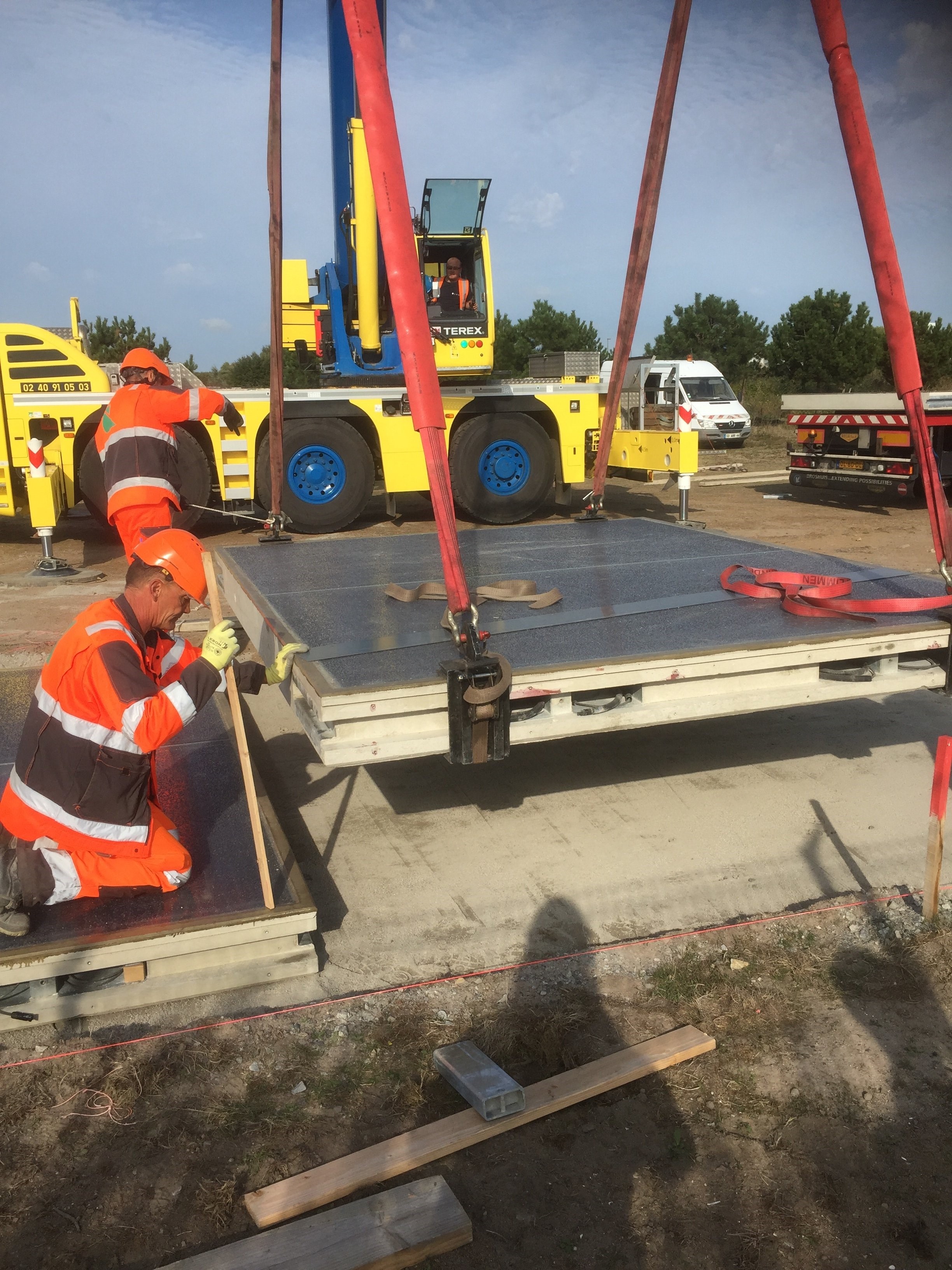 Sunny side up: workers in France install the SolarRoad kit in Etampes solaroad.jpg