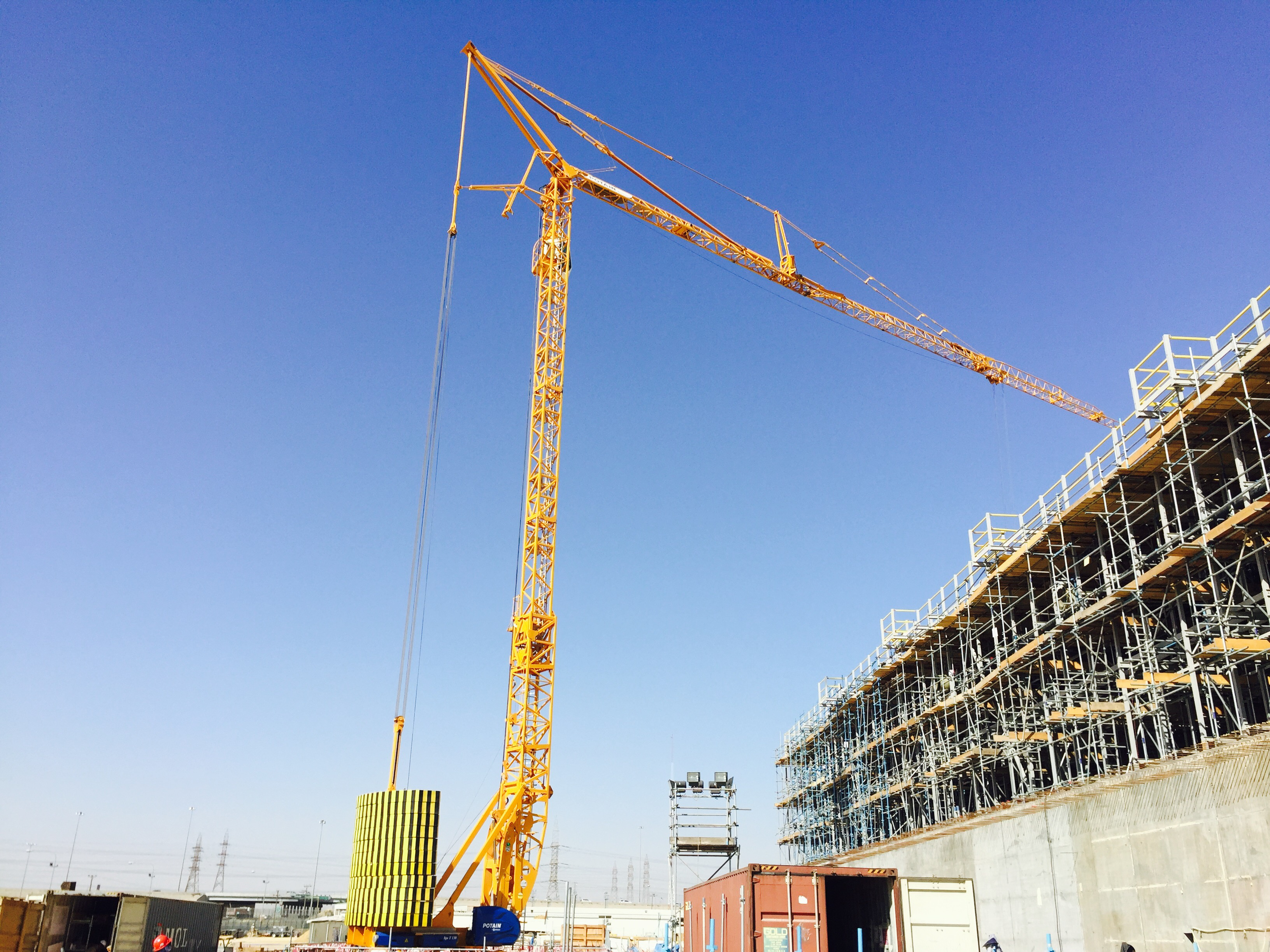 The Potain crane is being used to help with the construction of a car parking facility manitowockuwait.jpg
