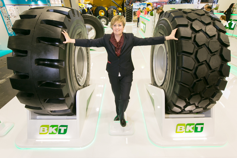 Gabriella Usiello, BKT marketing & communication manager, with two of the company’s at-show Earthmax tyres. The Earthmax range is celebrating its 10th anniversary BKT Tires-Gabriella Usiello-SR53 & SR31 02.jpg