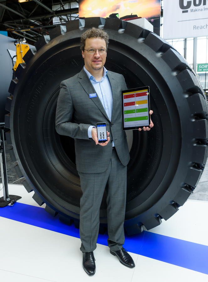 David Anckaert, Goodyear’s VP commercial tyres Europe, shows off the new TPMS Heavy Duty tyre pressure monitoring system GOODYEAR-David Anckaert with TPMS and EMTrack Apps-1.jpg