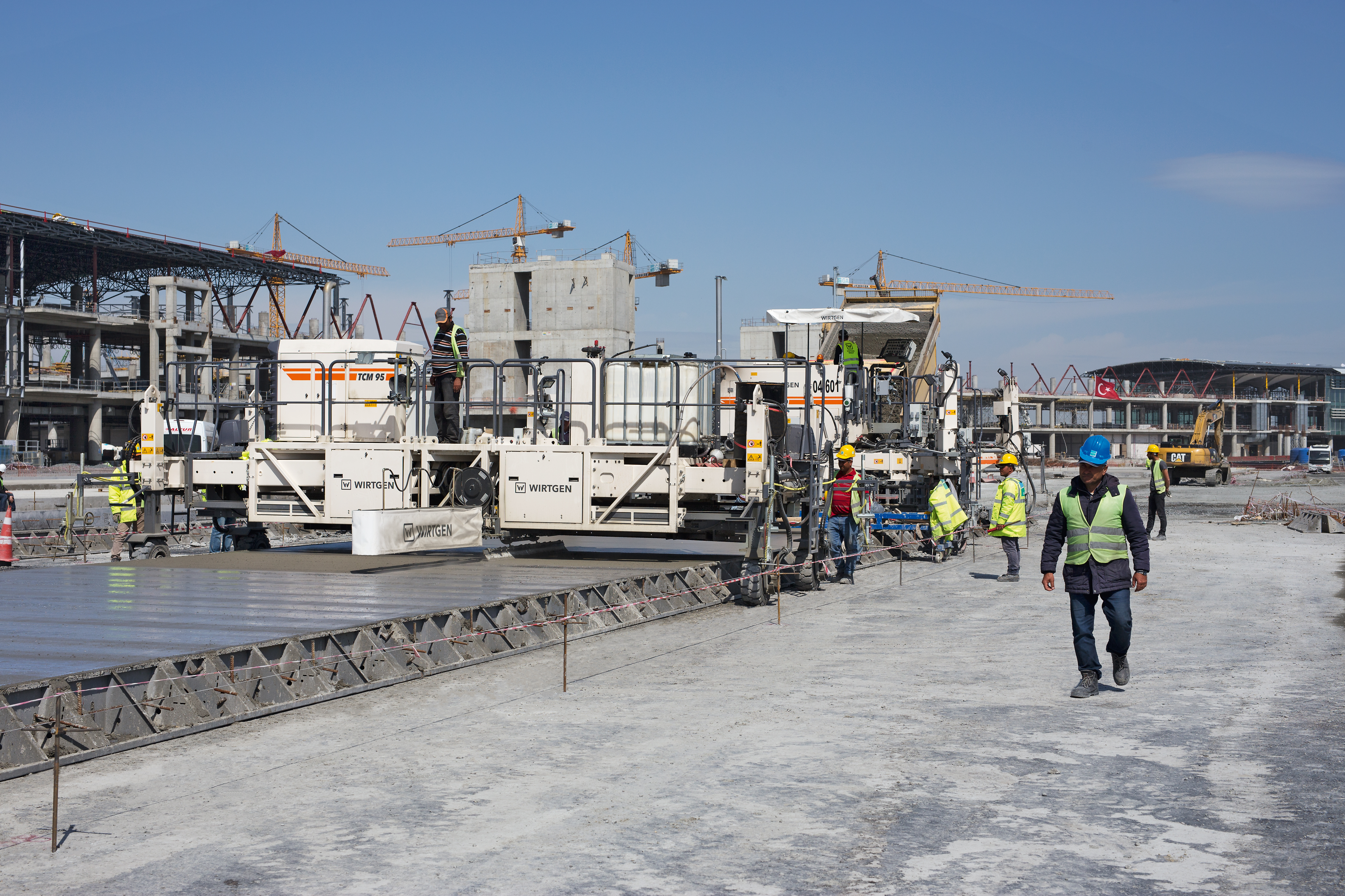 Three Wirtgen slipform pavers are at work on the taxiways in the apron Wirtgen-Istanbul-PIC1.jpg
