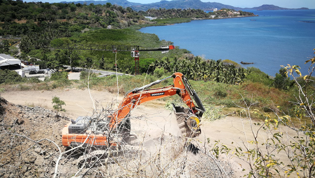 On the island of Mayotte, a crushing bucket from MB Crusher is being used to produce road bedding materials BF135.8_Mayotte.jpg