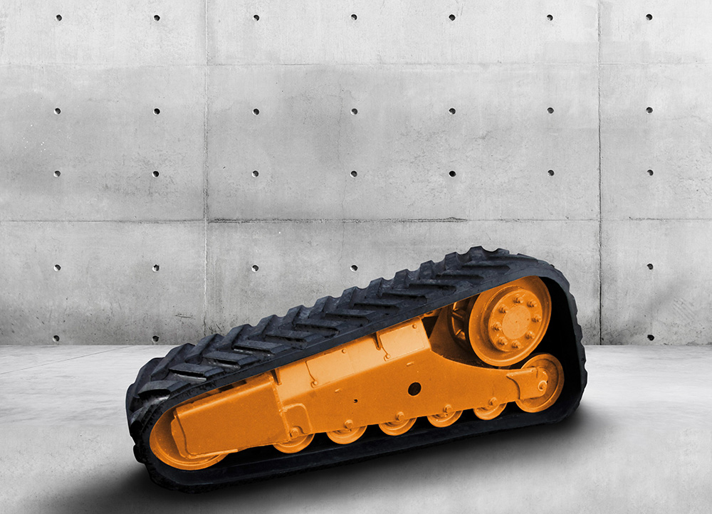 The new chassis system for compact loaders features a track with rubber drive lugs The new chassis system