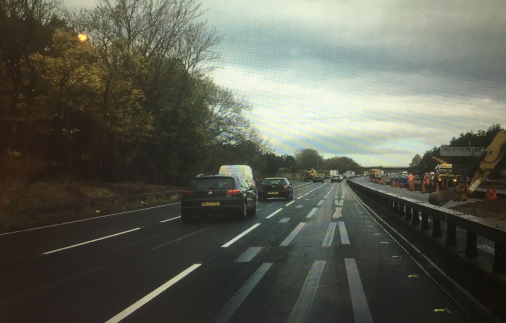 The white line towards the top of the picture shows a standard road marking, while in the foreground is one of the alternatives being tested The white line towards the top of the picture shows a standard road marking, while in the foreground is one of the alternatives being tested