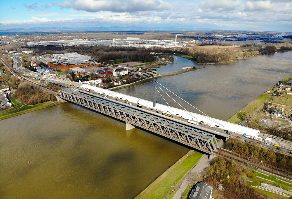 Kontent Structures installed an 18.5m-wide by 335m-long tent along the entire length of a bridge over the Rhine River in Karlsruhe, Germany, for work to continue regardless of weather (image courtesy Kontent Structures) Kontent Structures installed an 18.5m-wide by 335m-long tent along the entire length of a bridge over the Rhine River in Karlsruhe, Germany, for work to continue regardless of weather (image courtesy Kontent Structures)