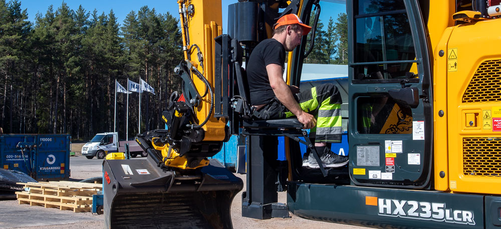 Up and away, thanks to a specially designed lift mounted on the front left side of Patrik Ketti’s 24-tonne Hyundai HX235 LCR crawler excavator (image courtesy Hyundai)