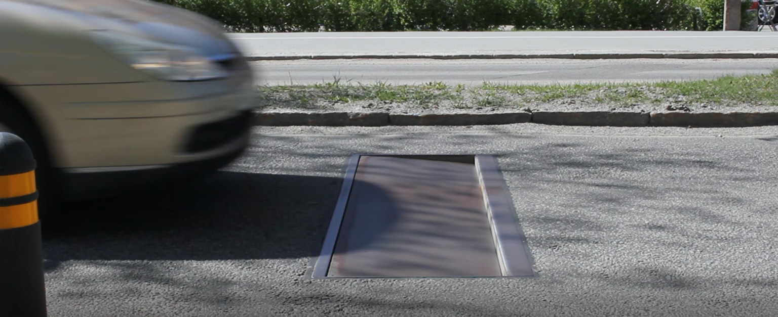 If a speeding vehicle is detected, then the Actibump plate, that normally lies flat with the road surface, will lower at one end, creating a bump (image courtesy Edeva)