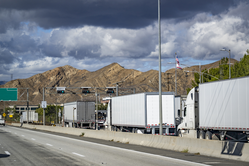 Traditionally, law enforcement agencies have used permanent, sometimes called fixed, roadside stations to weigh and inspect trucks and there can be lineups (image © Vitpho/Dreamstime)