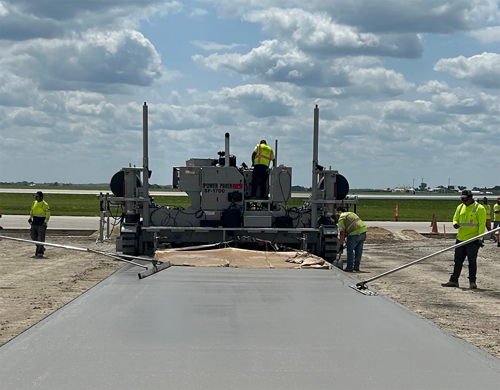 Contractor Metro Paving has been using an SF-1700 slipformer from Power Pavers to lay slab for new taxiways Contractor Metro Paving has been using an SF-1700 slipformer from Power Pavers to lay slab for new taxiways
