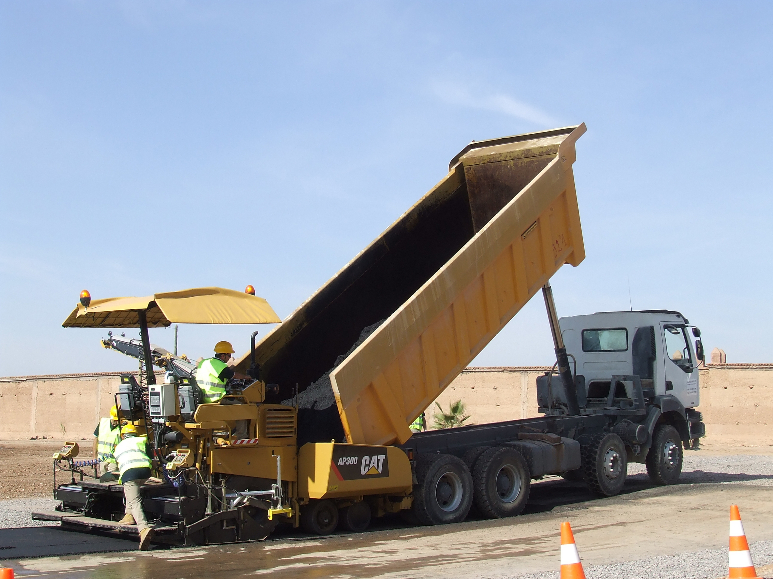 Caterpillar's AP300 is a versatile machine for smaller asphalt paving projects Cat AP300 paver being loaded