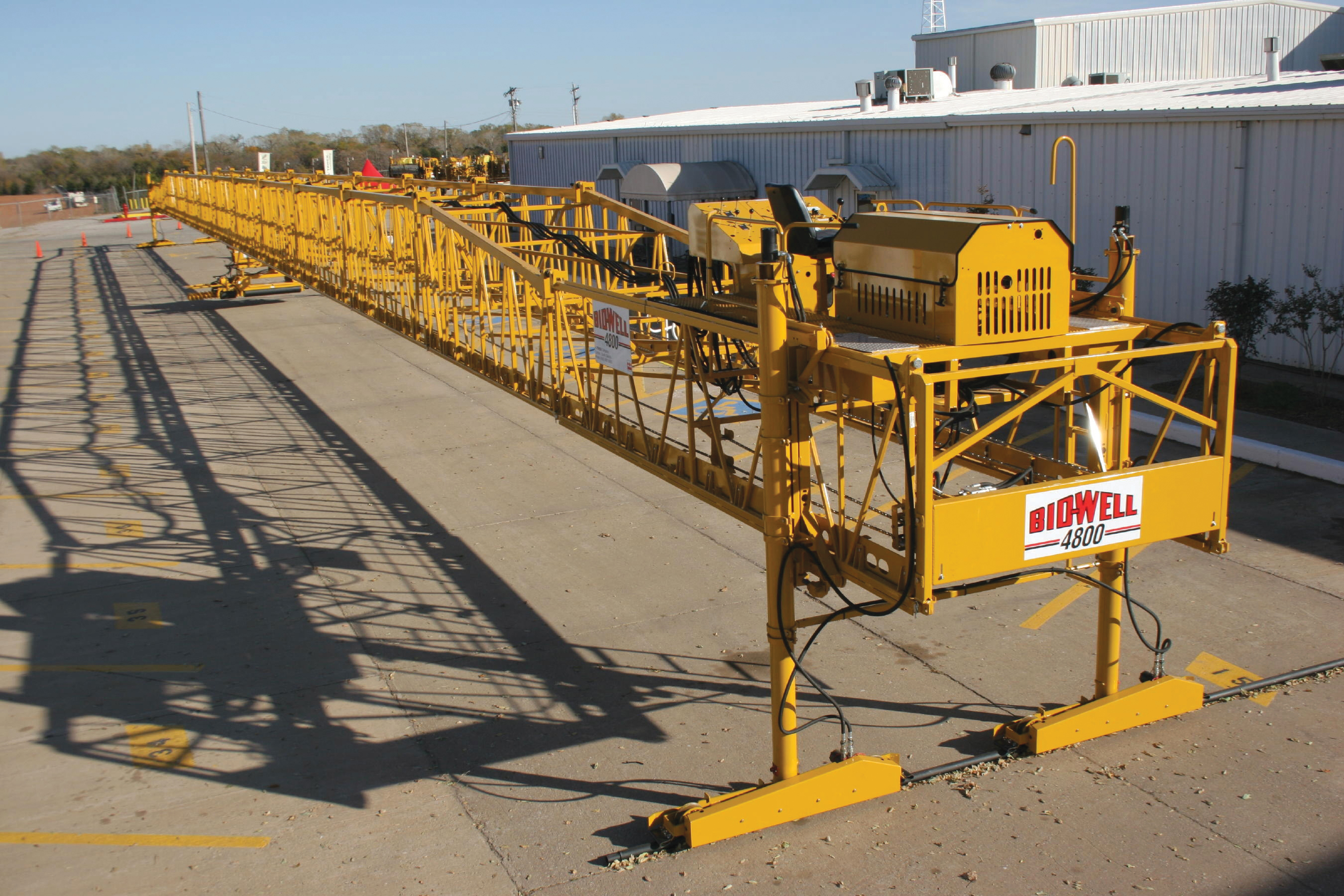 Terex's BidWell division is now offering a slipformer capable of handling extra-wide concrete slabs and aimed at bridge applications Bridge slipformer standing at site
