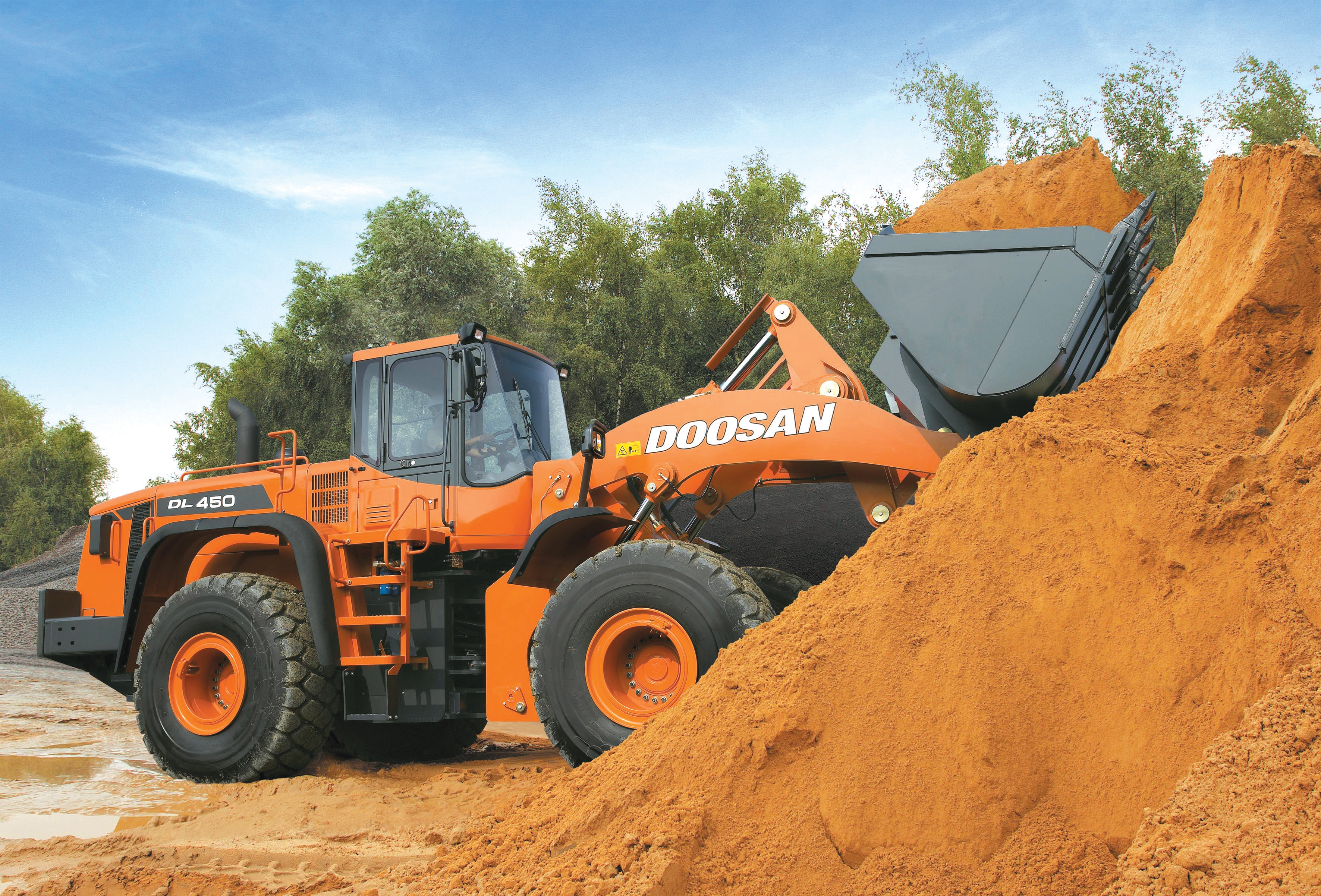 Doosan's new DL450 loader is equipped with the improved features introduced for the DL range Doosan loader hauling sand