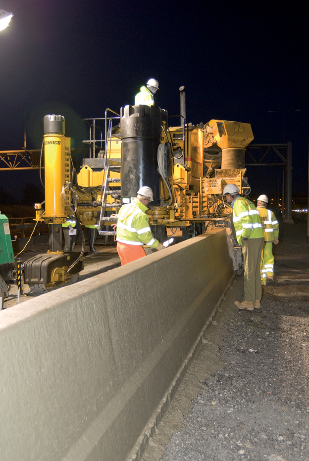 Slipformed concrete barriers are being installed on many of Europe's major highways to minimise crossover incidents. Slipformed concrete barriers being installed
