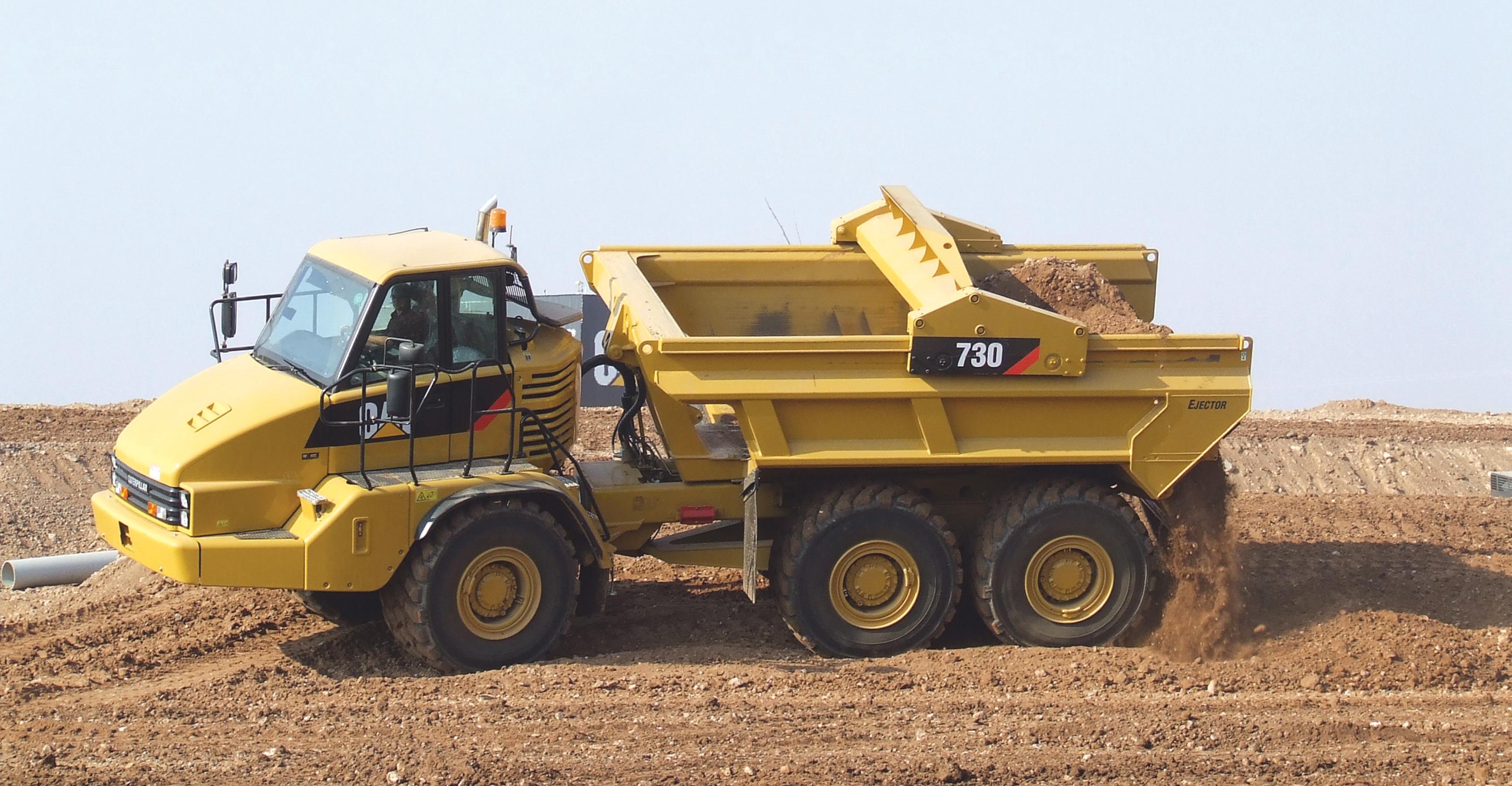 Caterpillar's novel discharge ADT uses scraper ejection technology and is able to dump on the move or on a slope Caterpillar ADT