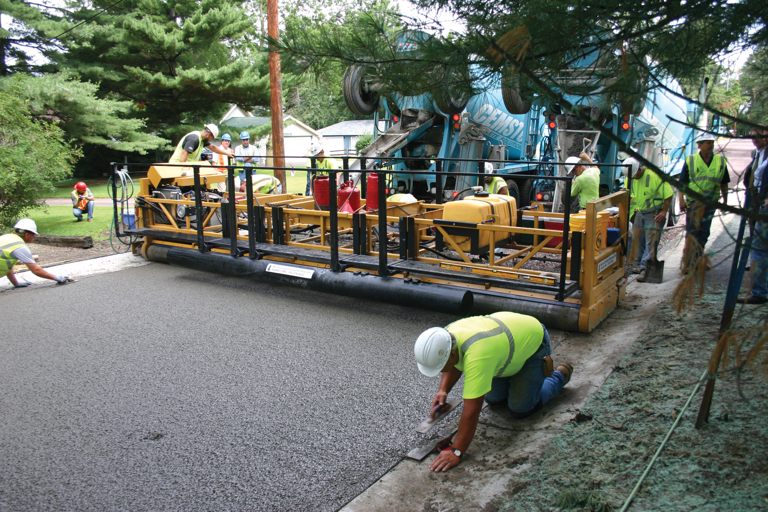 North County Concrete set up its Allen Triple Roller Tube Paver to pave the full width streets in one pass Allen Triple Roller tube Paver