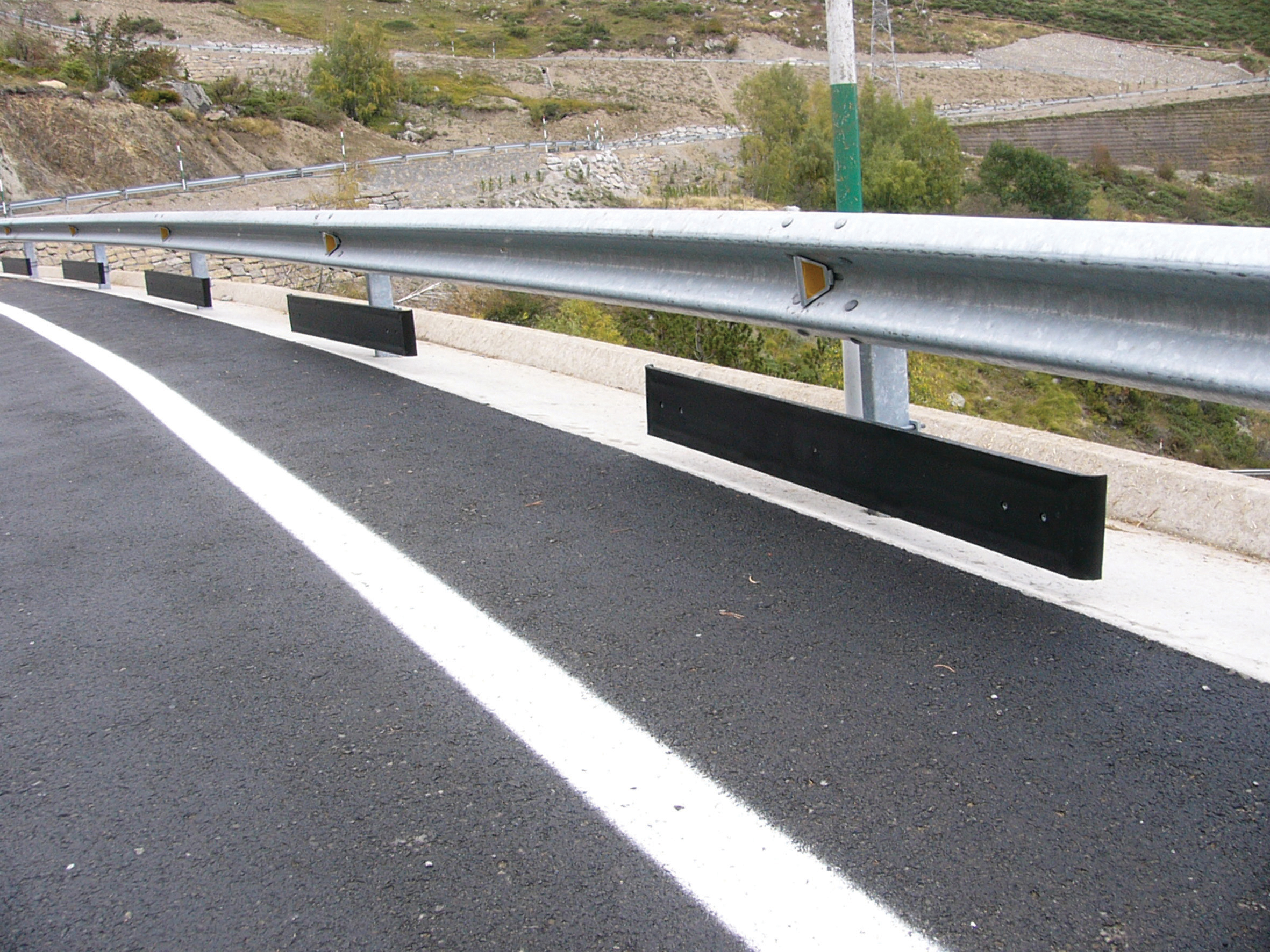 The Motoprotec system can be fitted to existing safety barriers and reduce the risks of motorcyclists striking support posts Motoprotec System in place