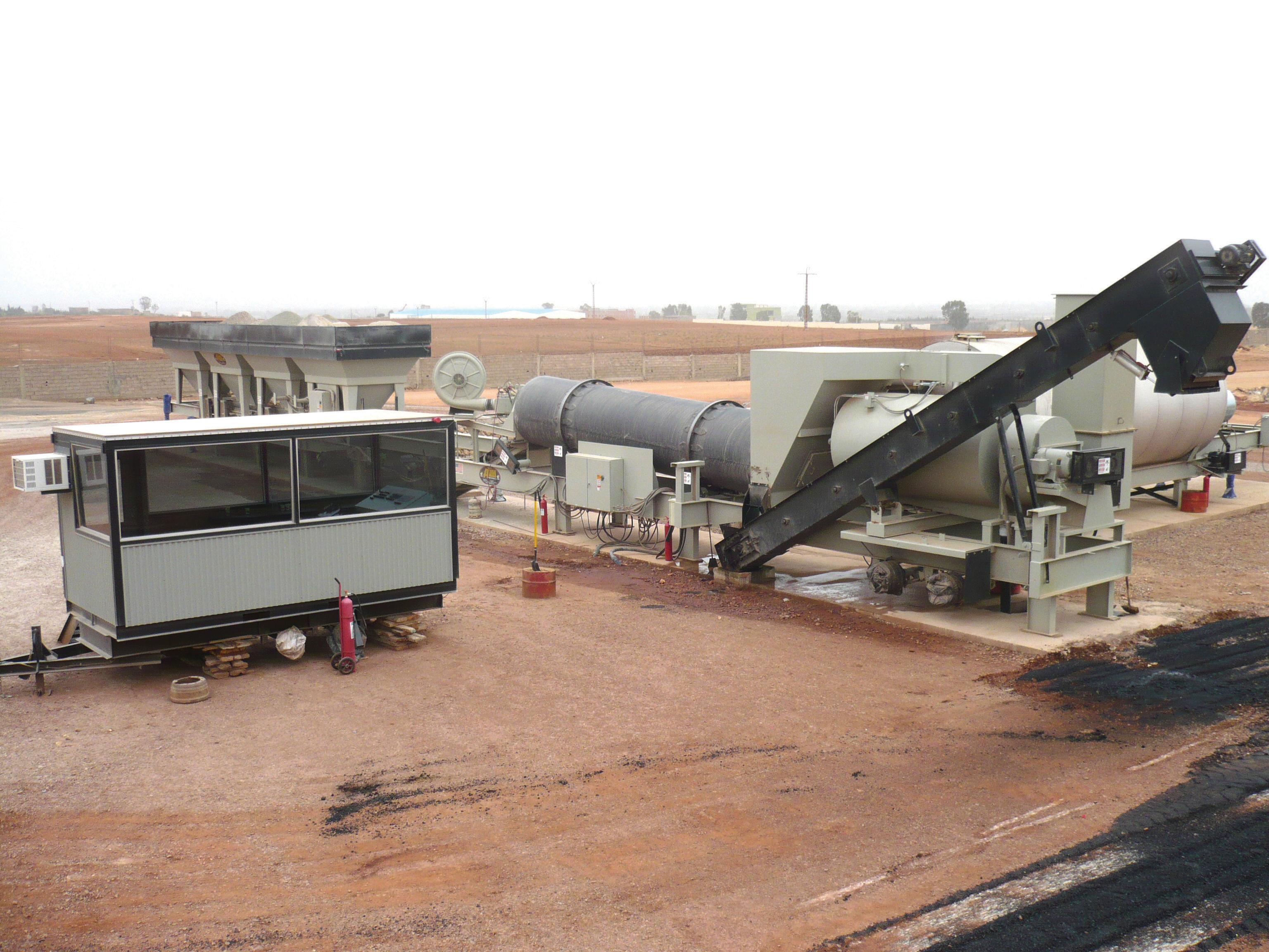 One of the 11 earthquake-resistant SIM-Ammann ashpalt mixing plants supplying Algeria's East-West Highway development SIM-Ammann asphalt mixing plant in Algeria