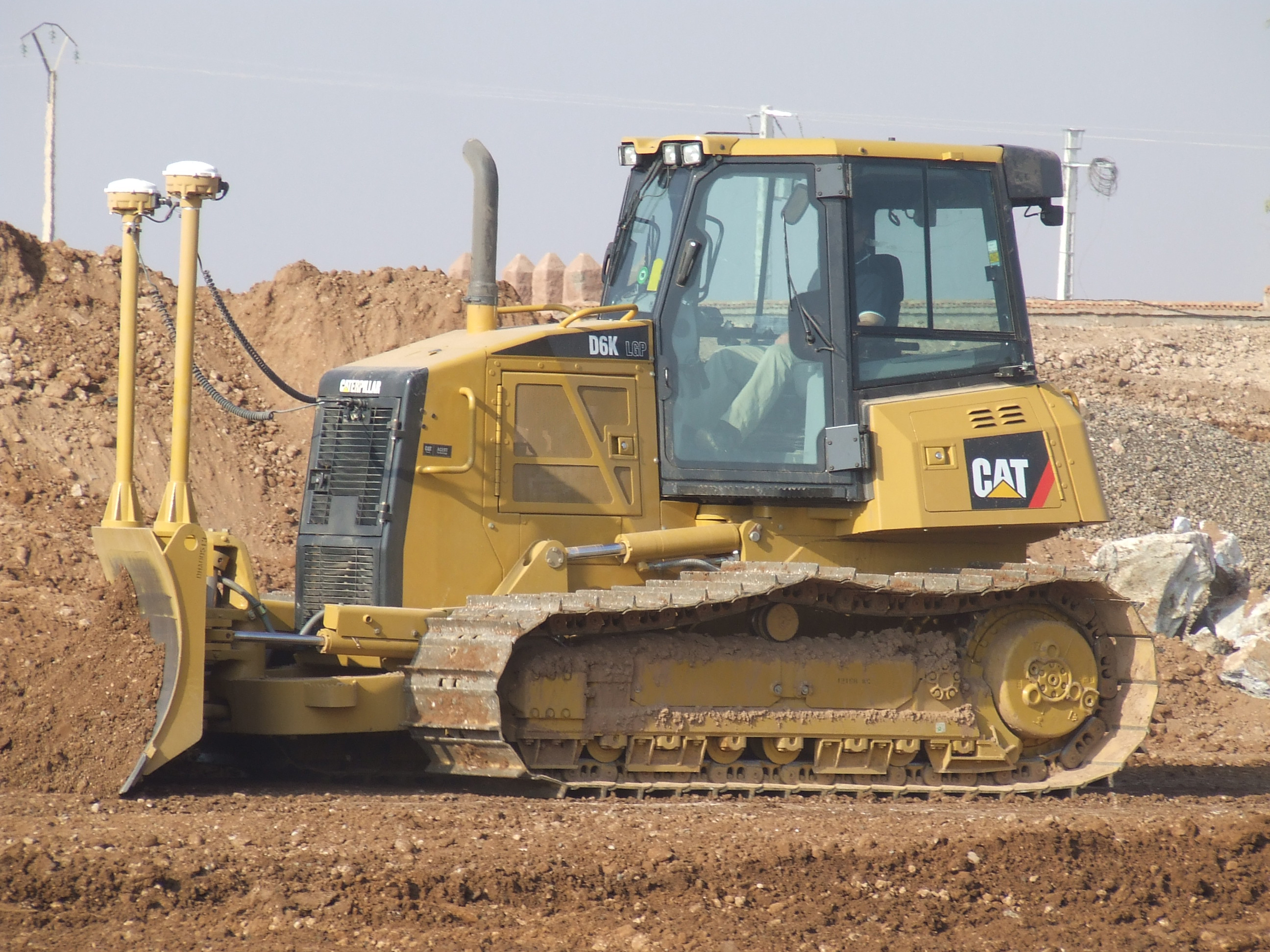 Machine control technologies allow contractors to cut to grade without the need for costly reworking, allowing fast payback times for equipment caterpillar tractor