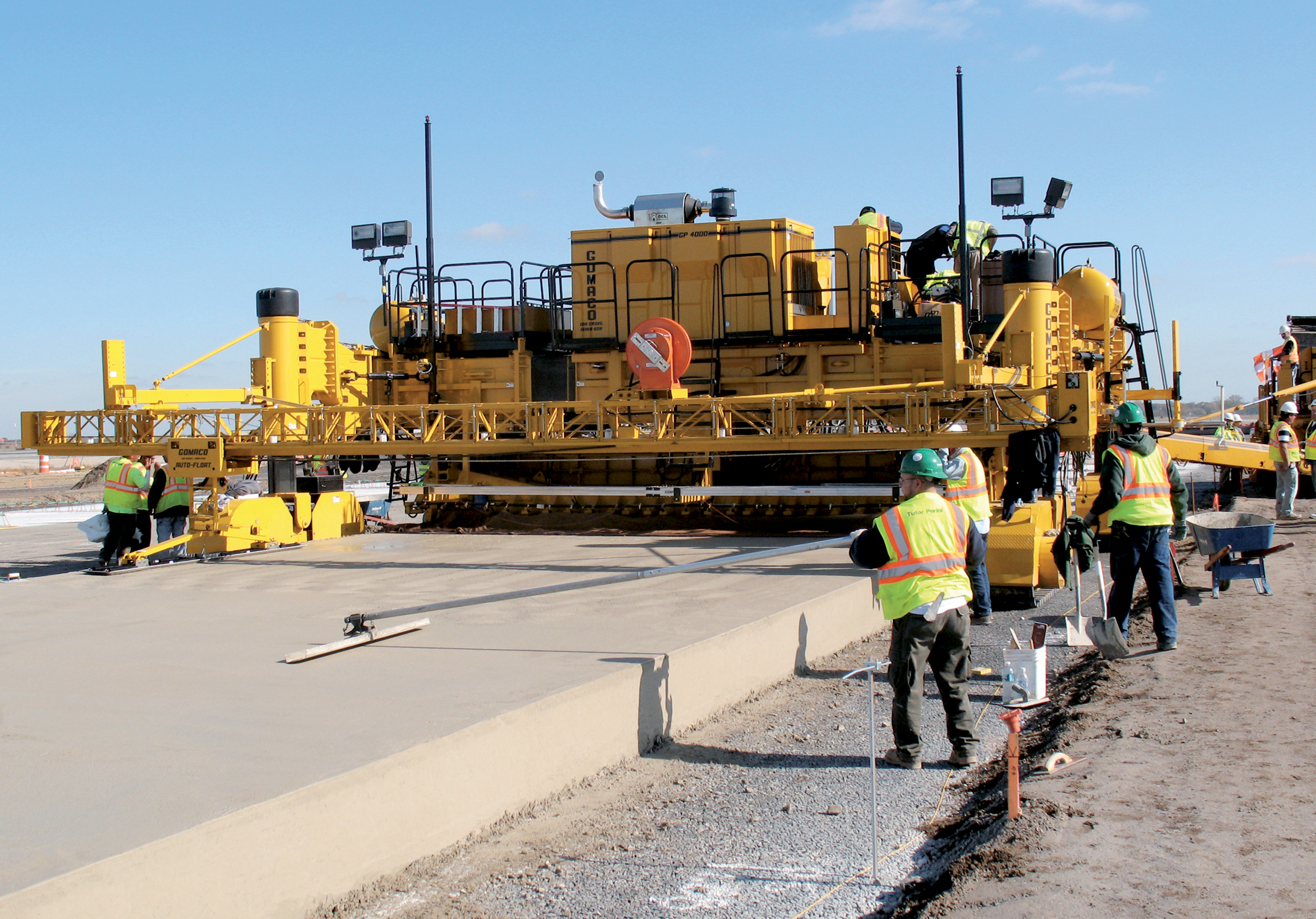 A GOMACO slipformer has been used to carry out the concrete paying work at JFK GOMACO slipformer