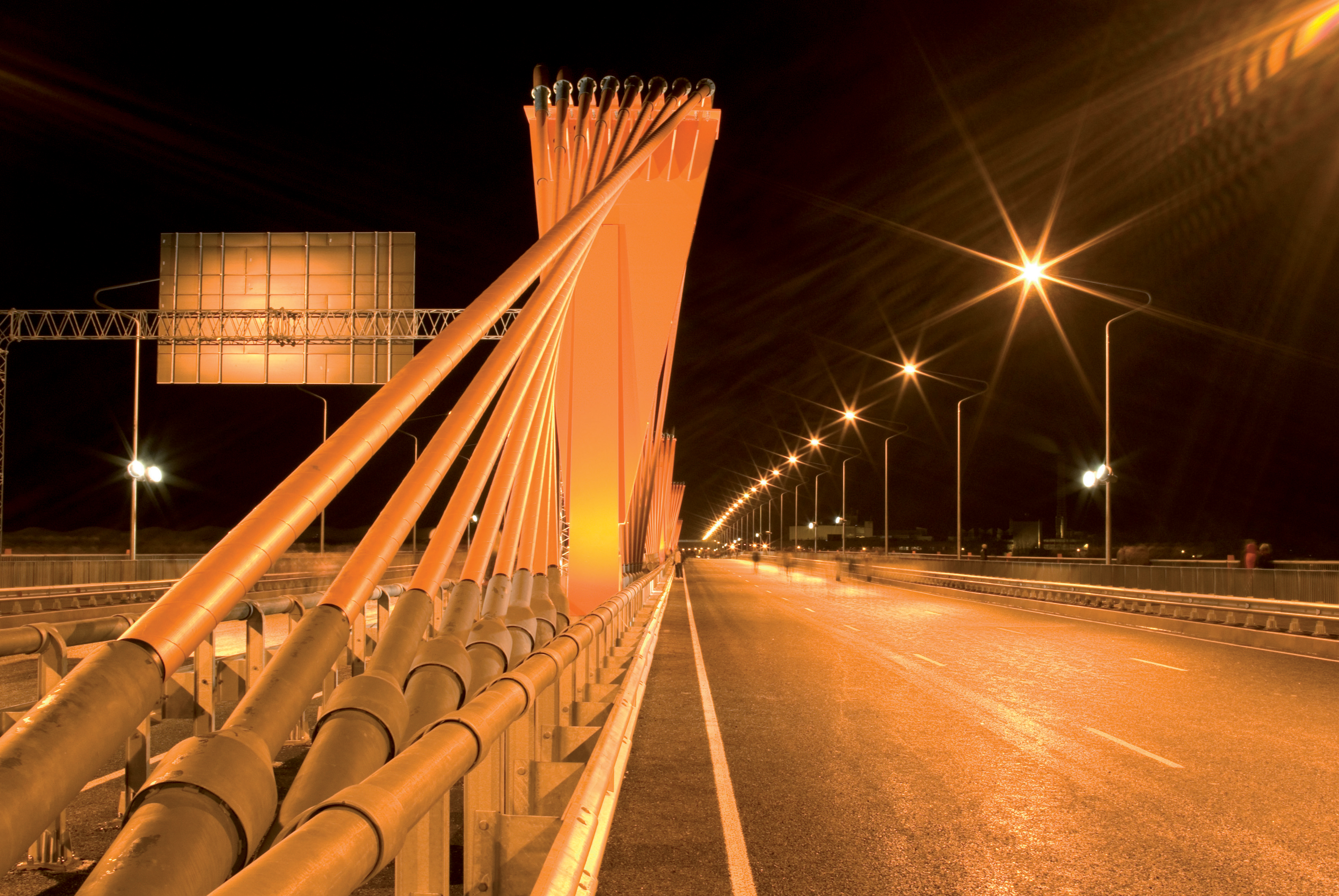 The impressive bridge at night showing the cables arranged in a fan shape Part of Riga's Southern Bridge