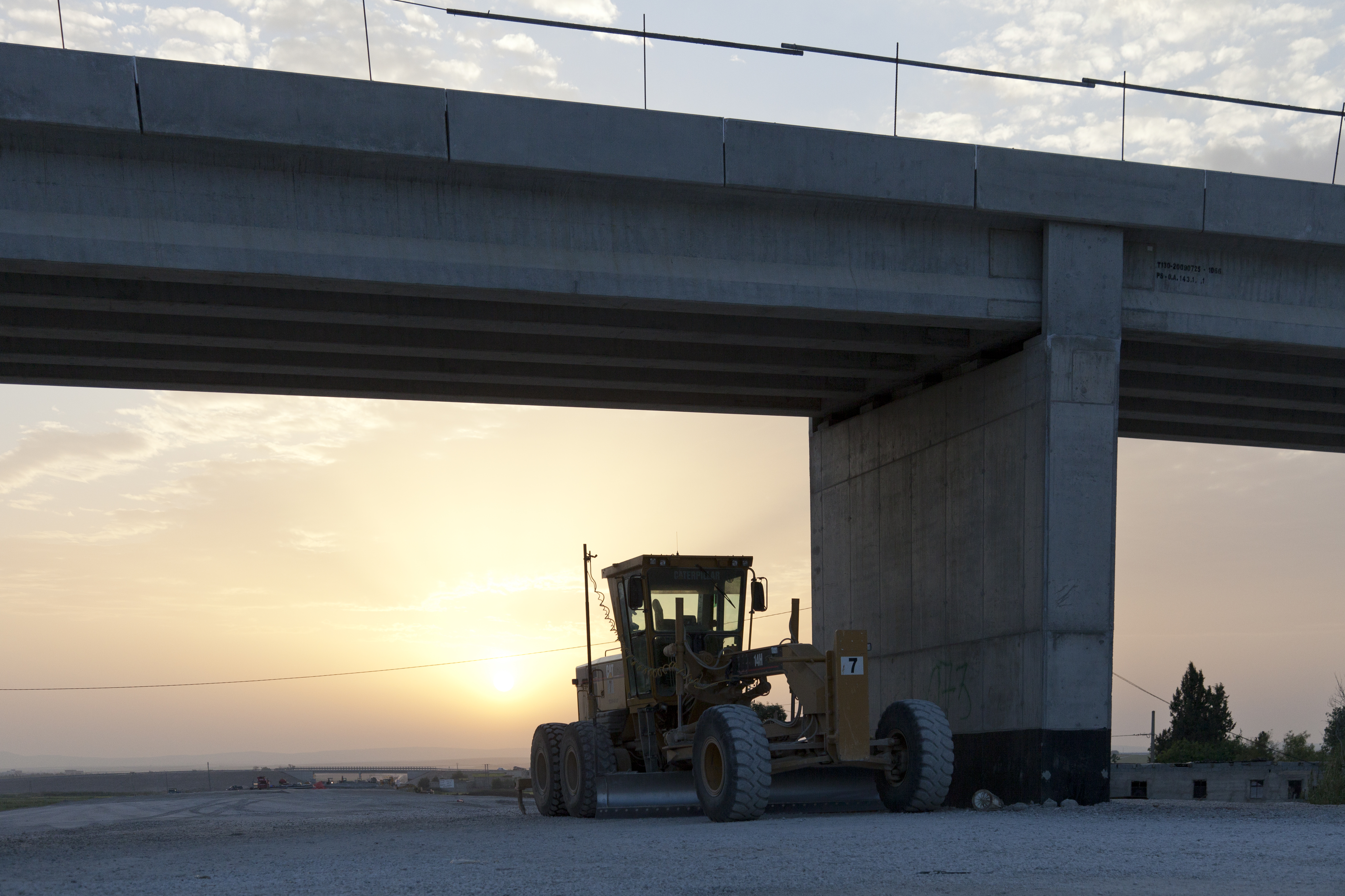 A fleet of Caterpillar machines is playing an important role in building Algeria's new highway network caterpillar machine in the sunset