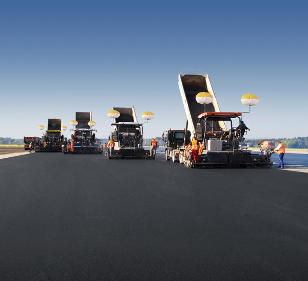 A team of Vögele pavers working echelon was used to place the new runway surface and this helped ensure a good quality bond between joints for a better quality finish and a longer working life Vögele Pavers at work