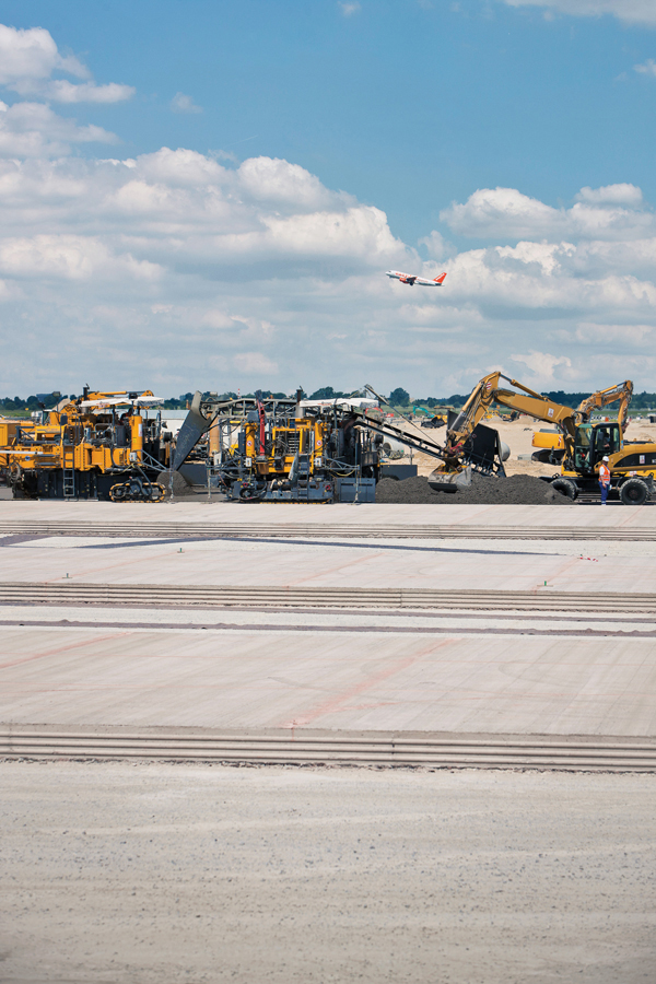 Aircraft still land and take off at the existing Schonefeld Airport, some 2km to the south Aircraft and pavers