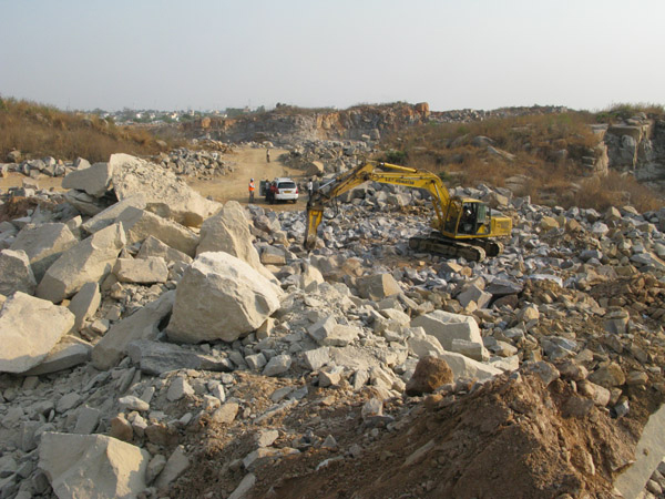 Ramky Infrastructure's Atlas Copco MB 1700 hydraulic breaker at a quarry site near the new road Atlas Copco MB 1700 at work