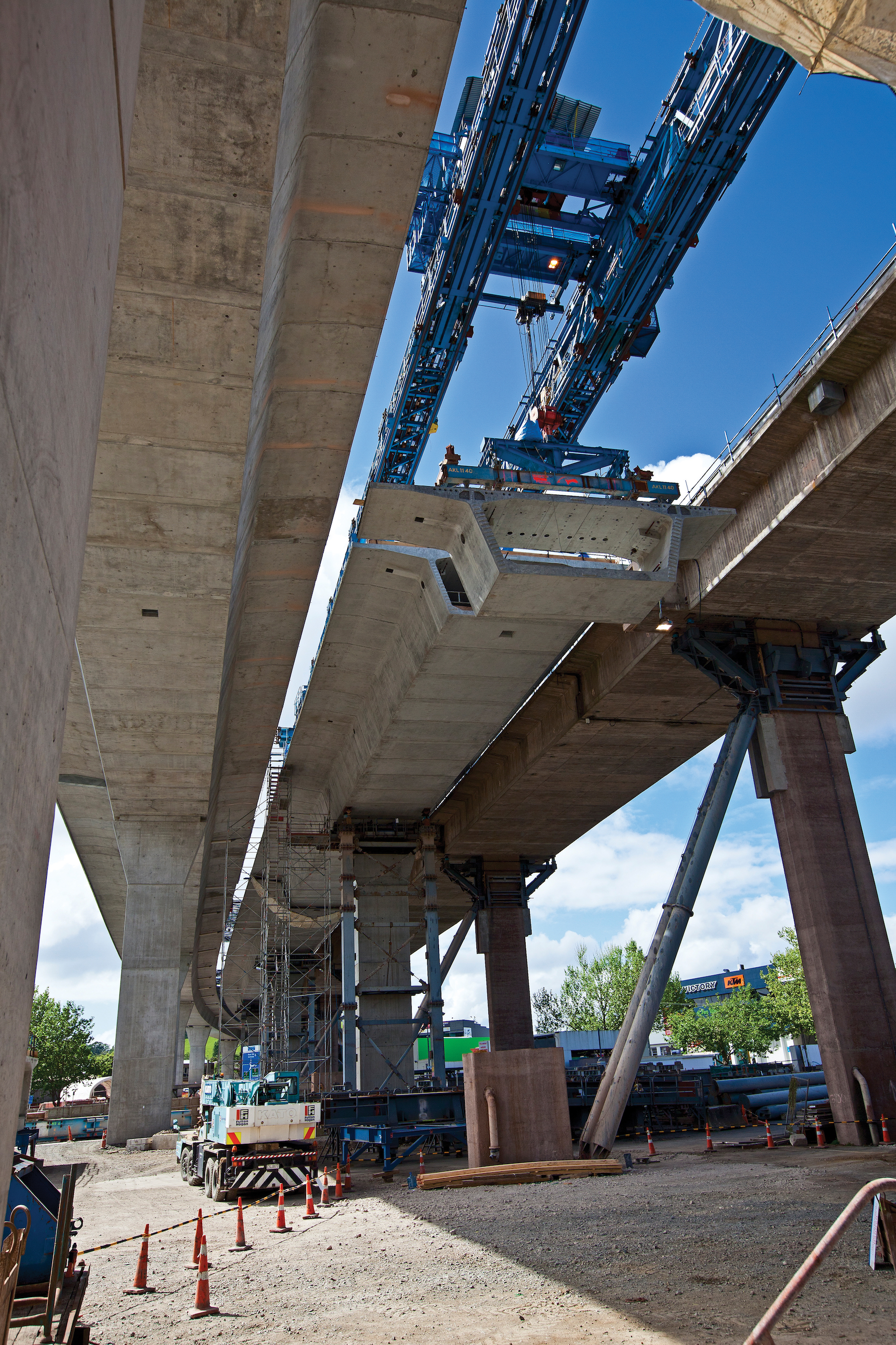 Newmarket - Gantry in Newmarket, lifting the new Northbond segment into place, between the new Southbound Viaduct (left) and the old Northbound route WH Apr 12 p 27 1