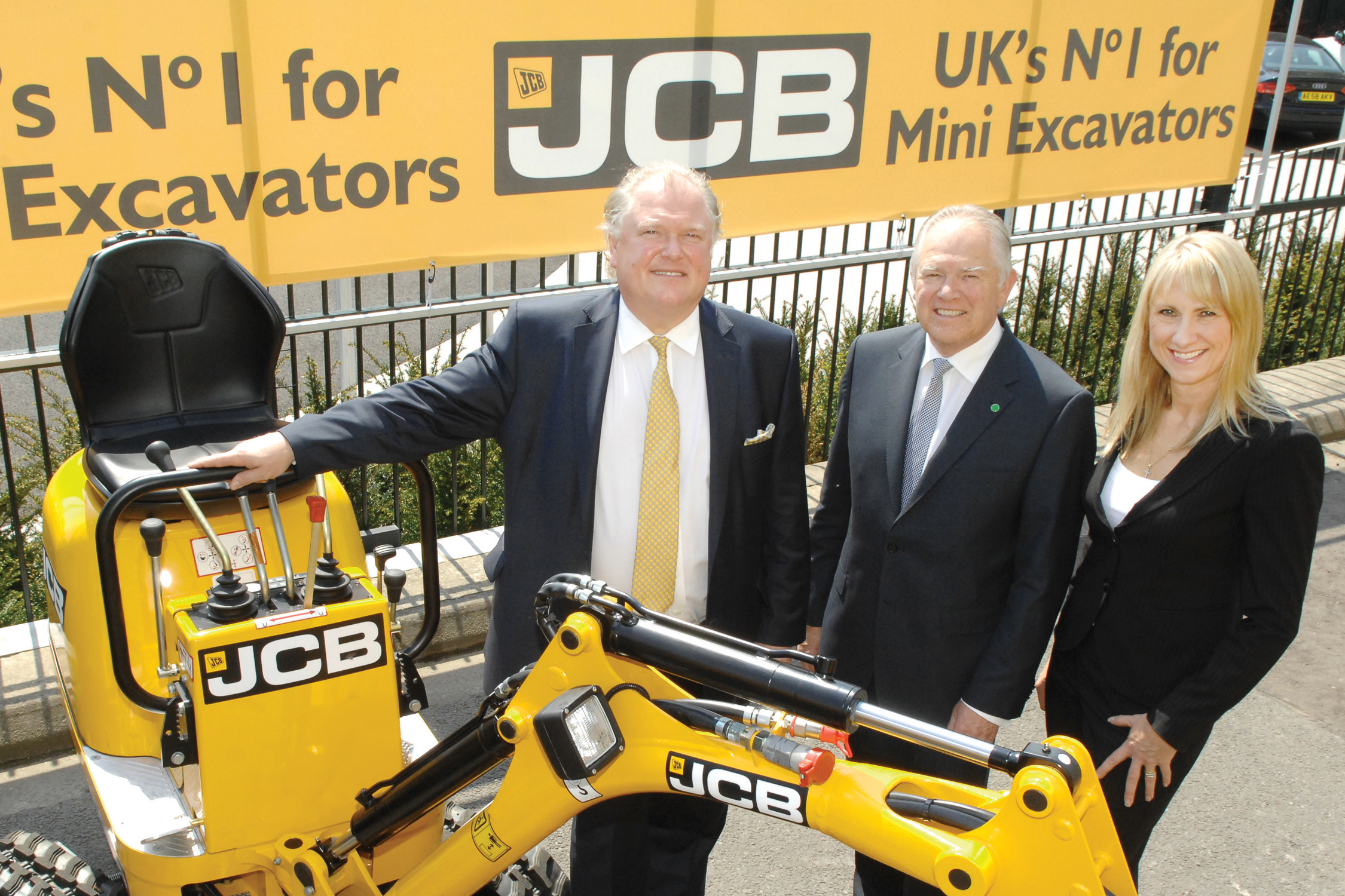 L-R: Lord Digby Jones; JCB chief executive Alan Blake and JCB UK and Ireland sales director Yvette Henshall-Bell pictured after the announcement of a US$56/8million (£36million) order, including 550 machines from A Plant JCB chief executive Alan Blake
