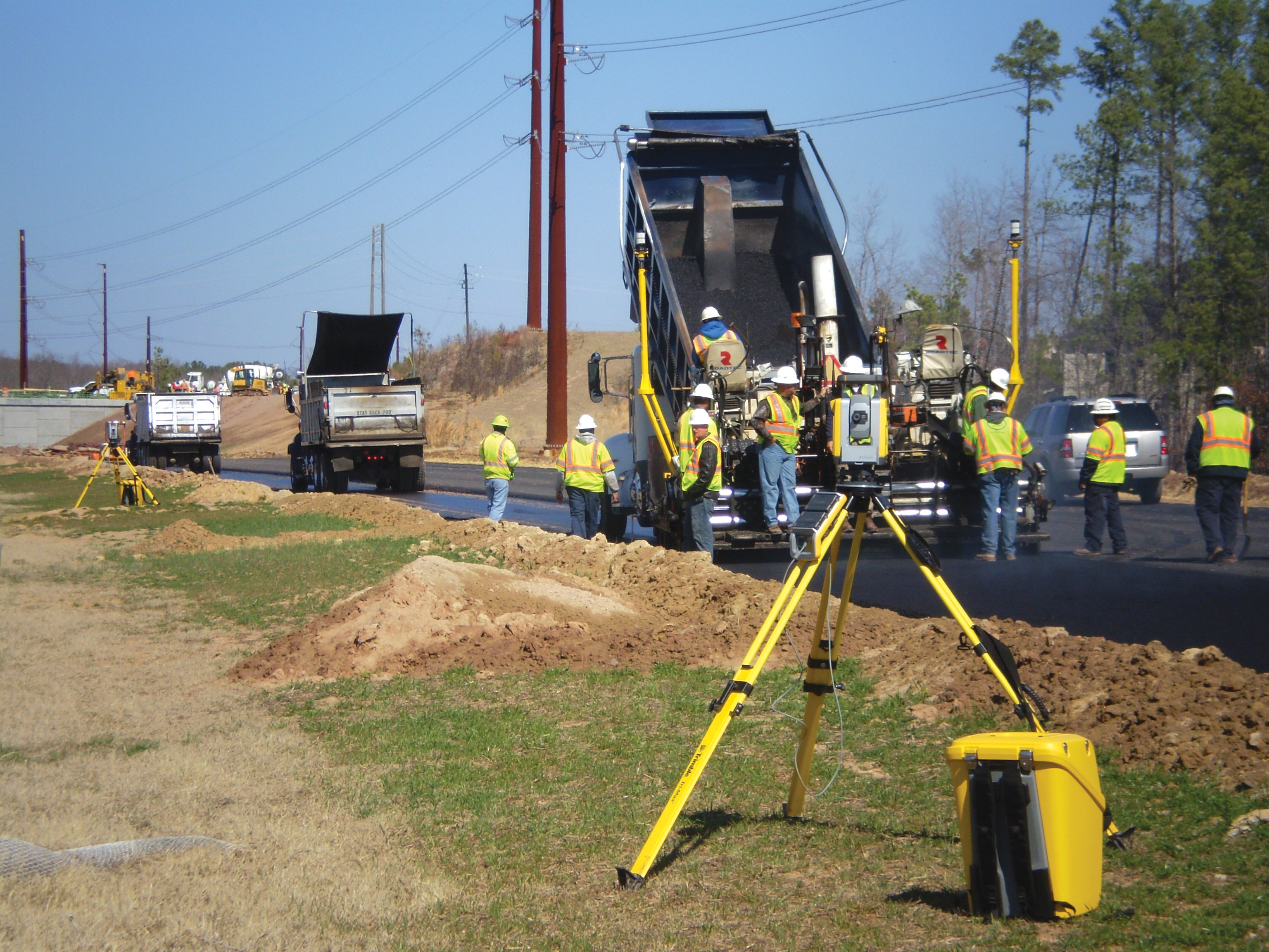 The machine control system was guided by robotic total stations placed at the roadside Machine control system at the roadside