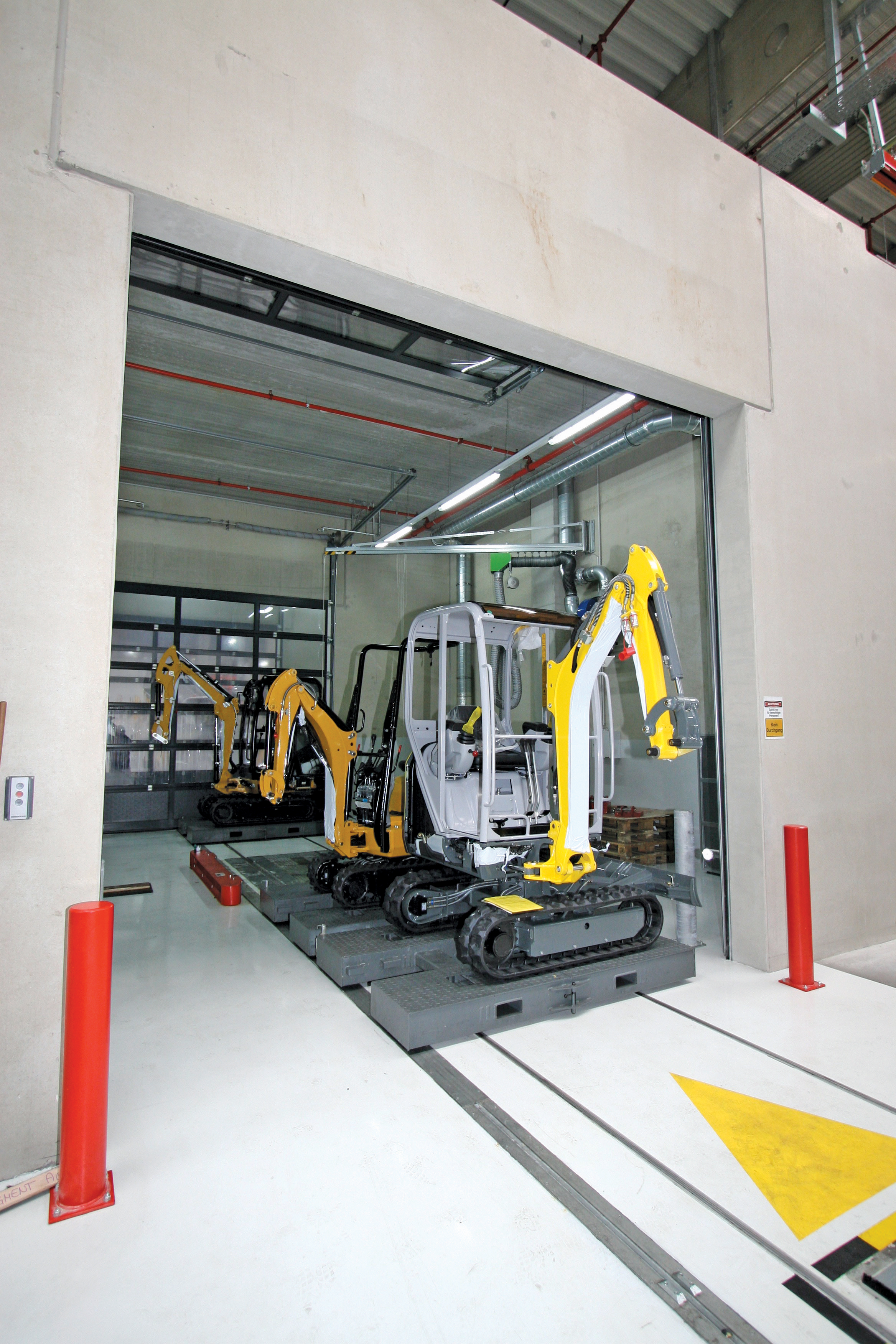 Wacker Neuson and Caterpillar compact excavators in one of the production line test areas in the big new factory near Linz Wacker Neuson and Caterpillar compact excavators