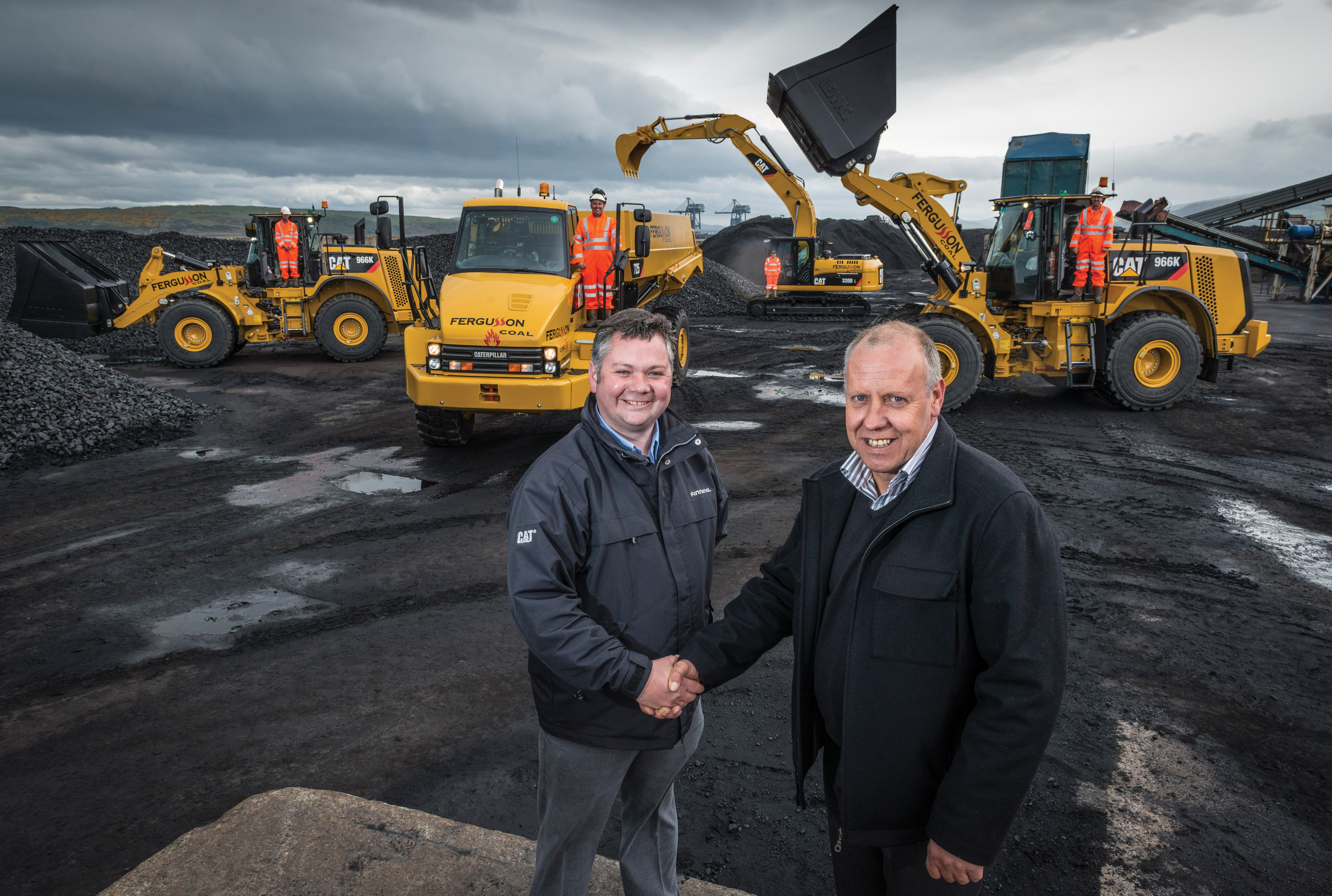 Oliver Halligan, Flinning's territory sales manager, (left) toasts the fleet deal with Fergusson Group's operations director, John Shute Fergusson Manager shaking hands with director