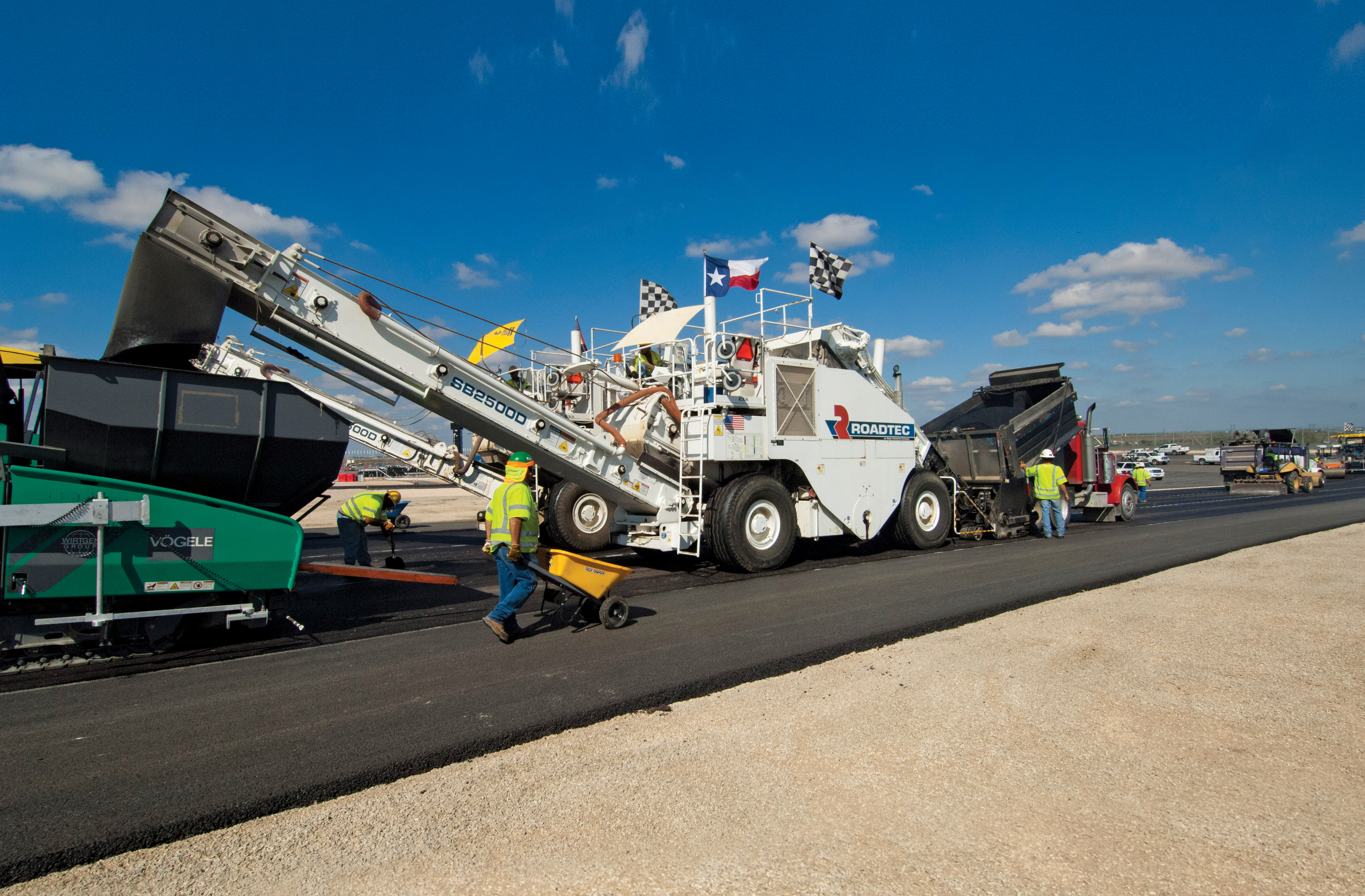 Roadtec’s SB-2500D shuttle buggy at work on the COTA construction project Roadtec’s SB-2500D shuttle bugg