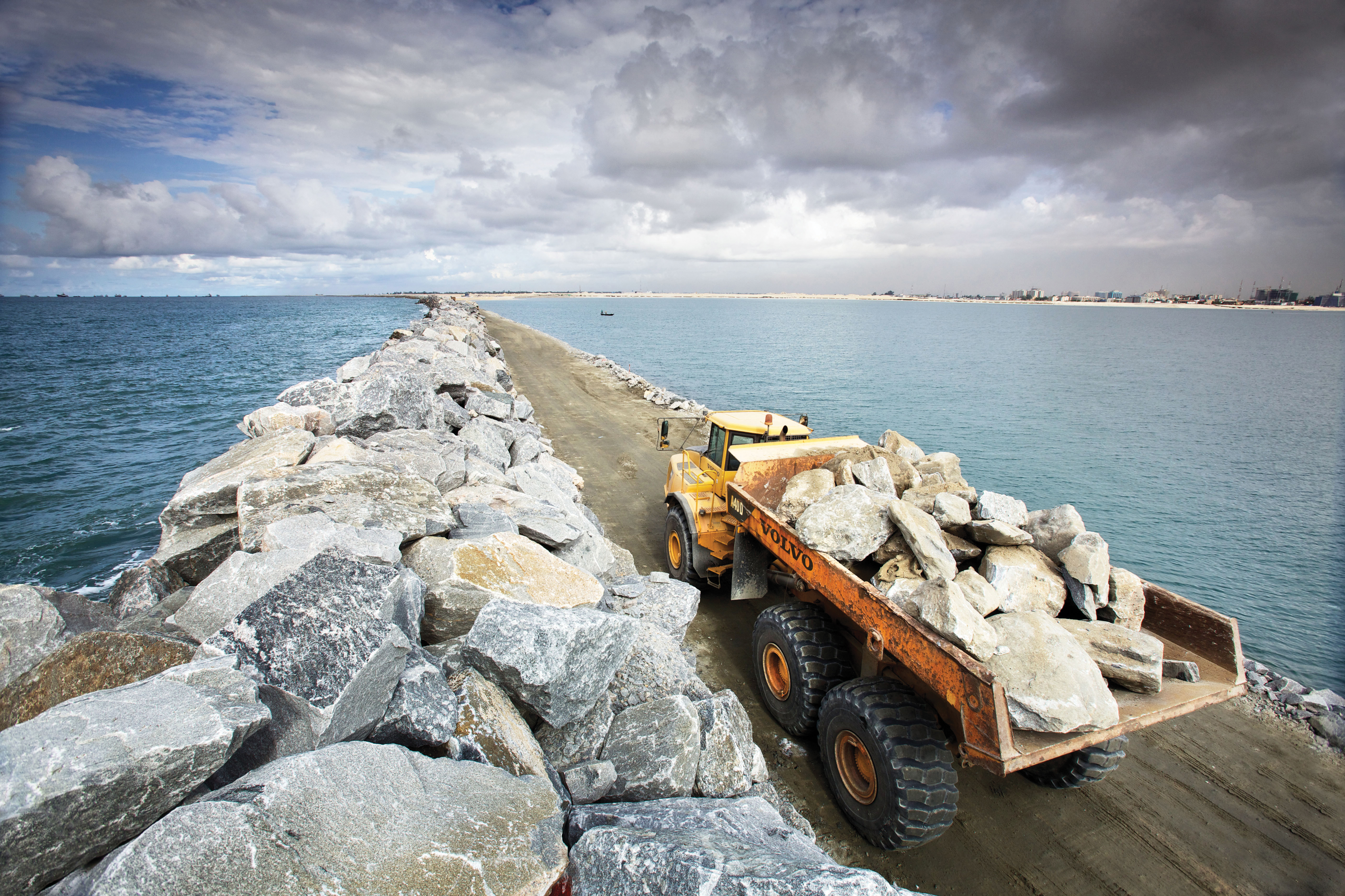 Huge stones are placed at the Eko Atlanic project to construct the causeway Nigerian Development Volvo Truck
