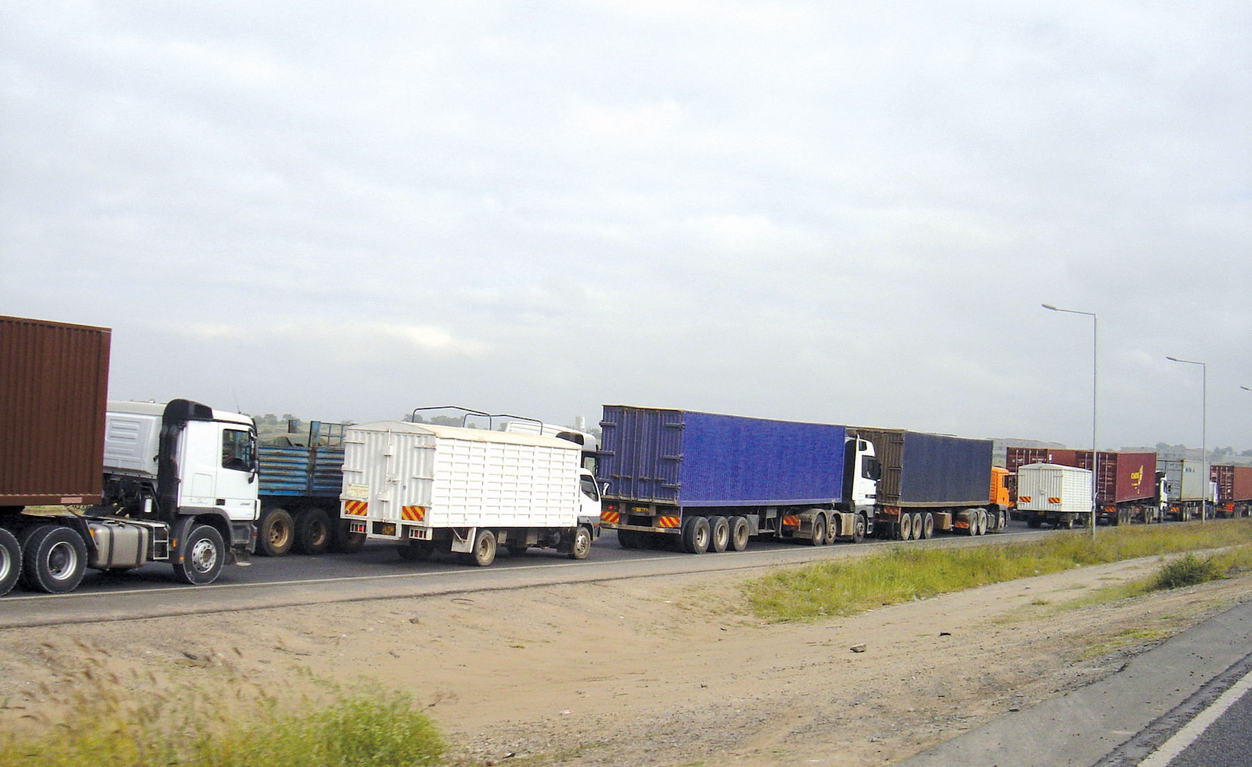These trucks on Mombasa Road, were captured waiting for their turn to make it to Nairobi’s Central Business District (CBD) passing through Uhuru Highway on their way to western Kenya, Uganda and Rwanda.
Photo: Shem Oirere Trucks on Mombasa Road western Kenya