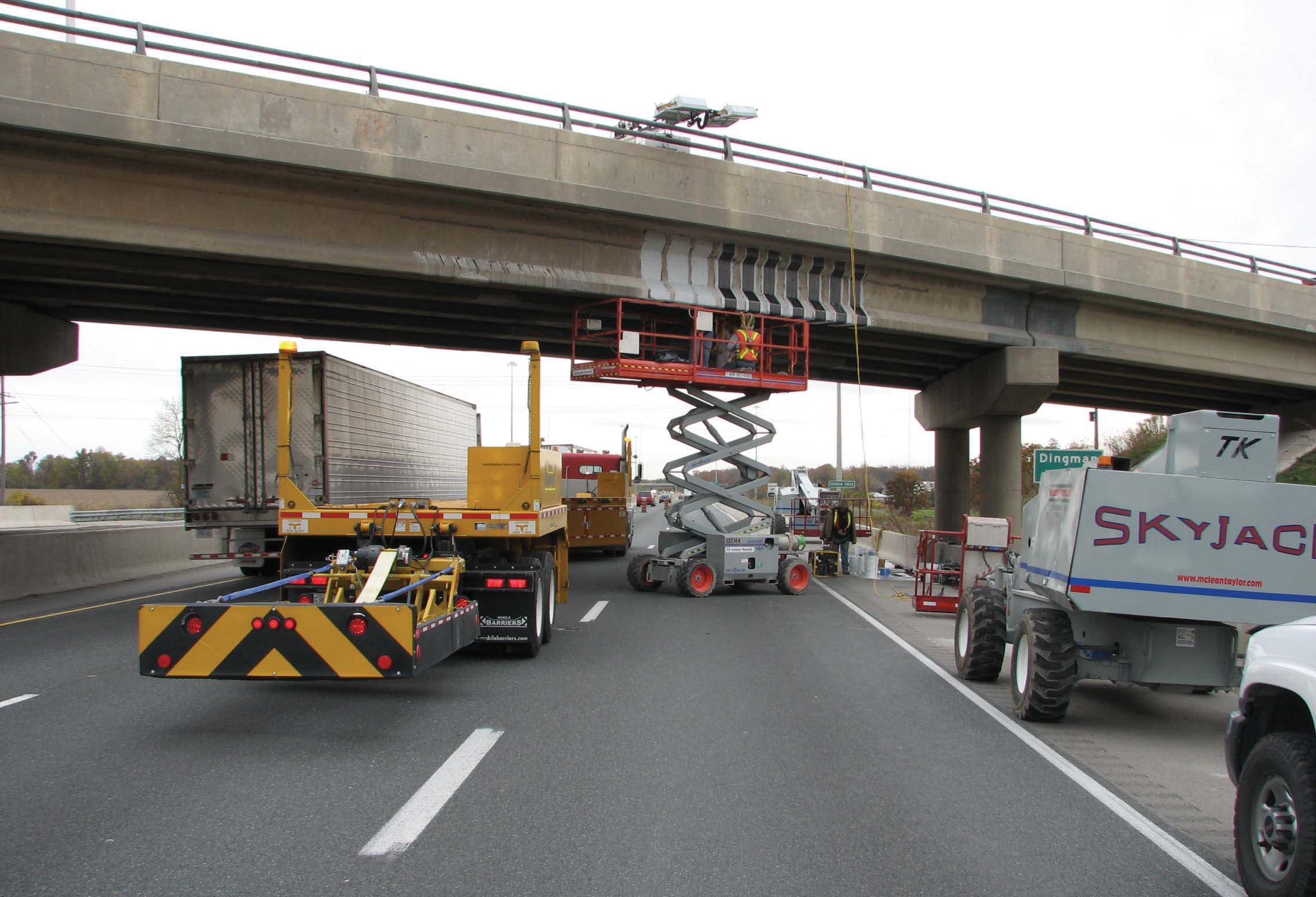 Mobile Barriers 1: The MBT-1 mobile barrier with scissor lift being used near London in Ontario, Canada MBT-1 mobile barrier with scissor lift