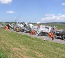 Caterpillar and Roadtec equipment  3-piece paving train 