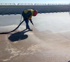 Grit blasting the steel deck