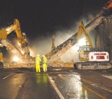 Powerful demolition tools removing the bridge 