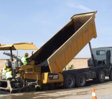 Cat AP300 paver being loaded