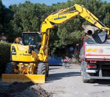komatsu excavator filling truck