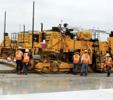 IDBI doel bar insertion system and GOMACO paver
