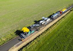 Granulation, mixing and paving in a single pass: the Wirtgen Group cold recycling train sustainably and efficiently rehabilitated an agricultural road in the Netherlands while saving resources.